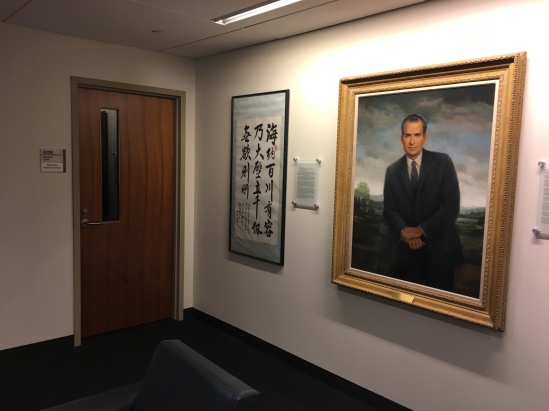 painting of Richard Nixon hung on the wall outside Atiba Ellis's research carrel